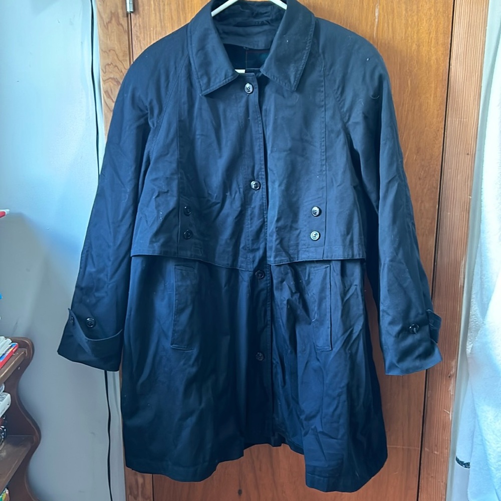 Womans coat/jacket has all buttons
